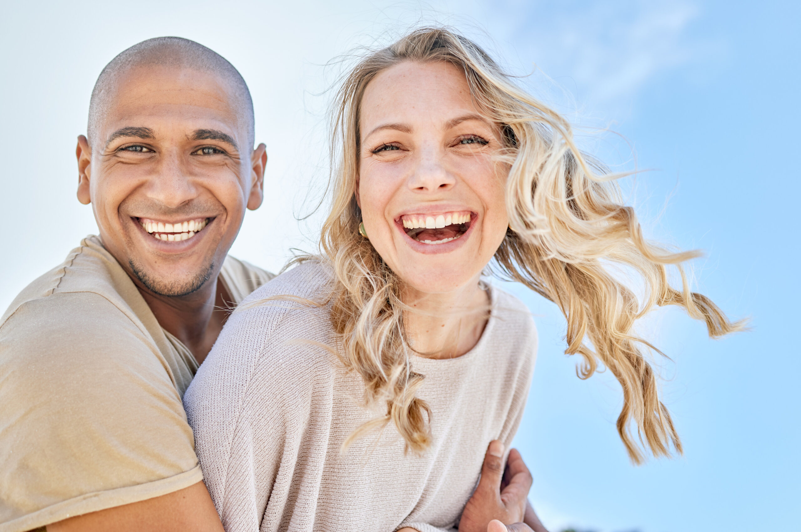 couple adults with healthy smiles on a sunny day